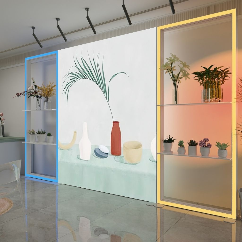 Open RGB LED frames with glass shelves either side of a backlit wall, lit blue and yellow in a florist showroom