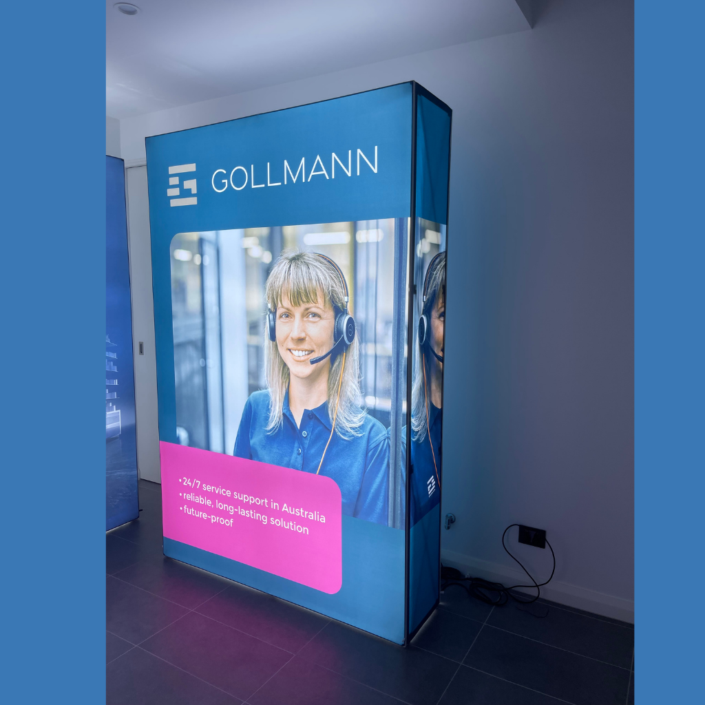 Freestanding 1.5m wide SEG backlit pop up media wall printed on the front and side