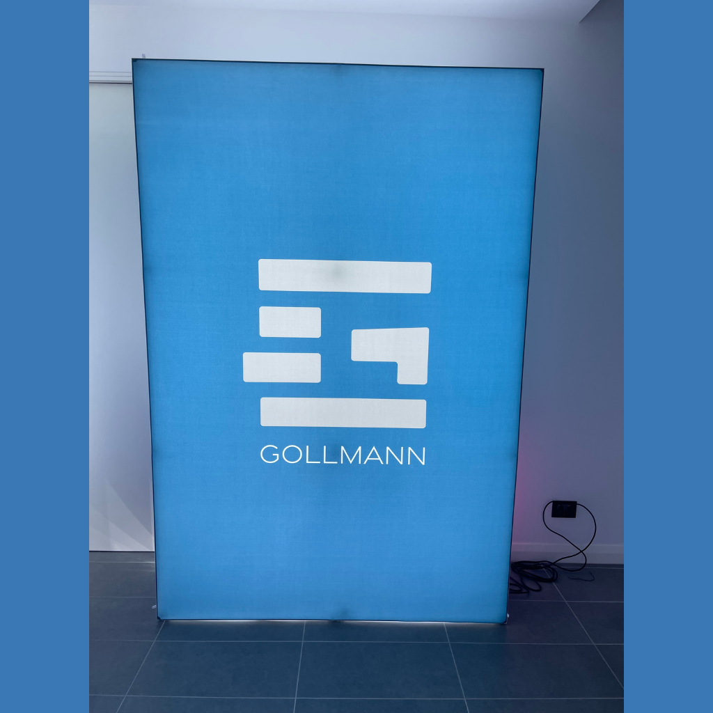 1.5m wide SEG backlit pop up media wall lit up in a showroom