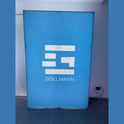1.5m wide SEG backlit pop up media wall lit up in a showroom