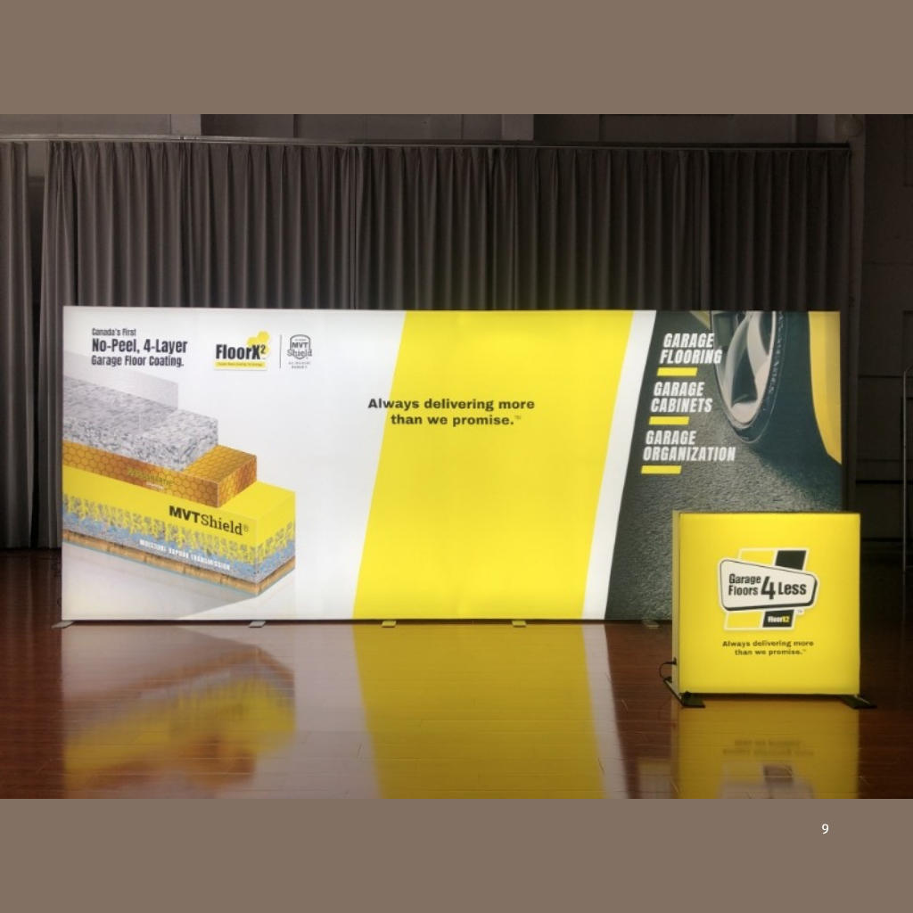 6m SEG backlit fabric media wall lit up on a premium tradeshow Stand with backlit counter