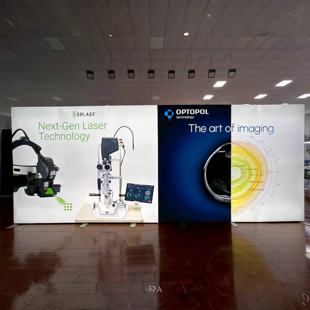 6m SEG backlit fabric media wall lit up on a premium tradeshow Stand