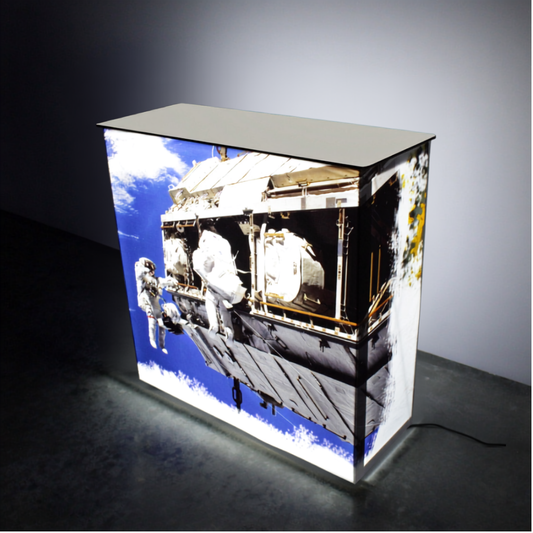 SEG backlit pop up counter 1m, custom printed and illuminated, at a trade show stand