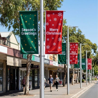 Green and red Christmas street flags on council street poles along an Australian shopping street, printed 1000 x 3000mm polyester flags