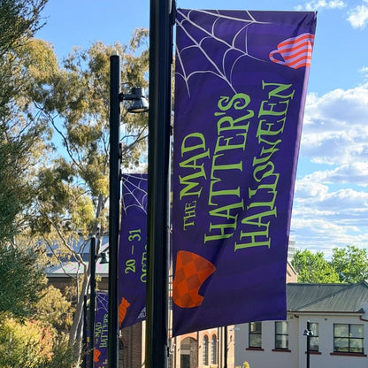 Purple Halloween street flag on a black banner pole in a Sydney precinct, 1000 x 3000mm with top rod pocket and side loops