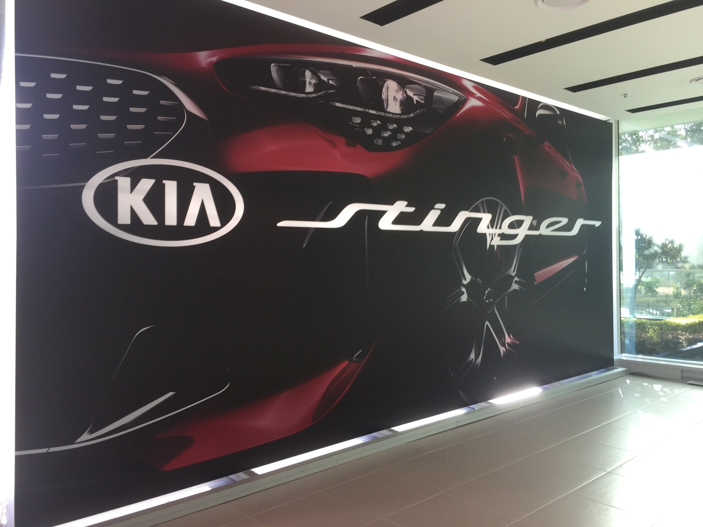 7.5-metre backlit fabric lightbox seen from inside the Kia Australia head office showroom, Sydney