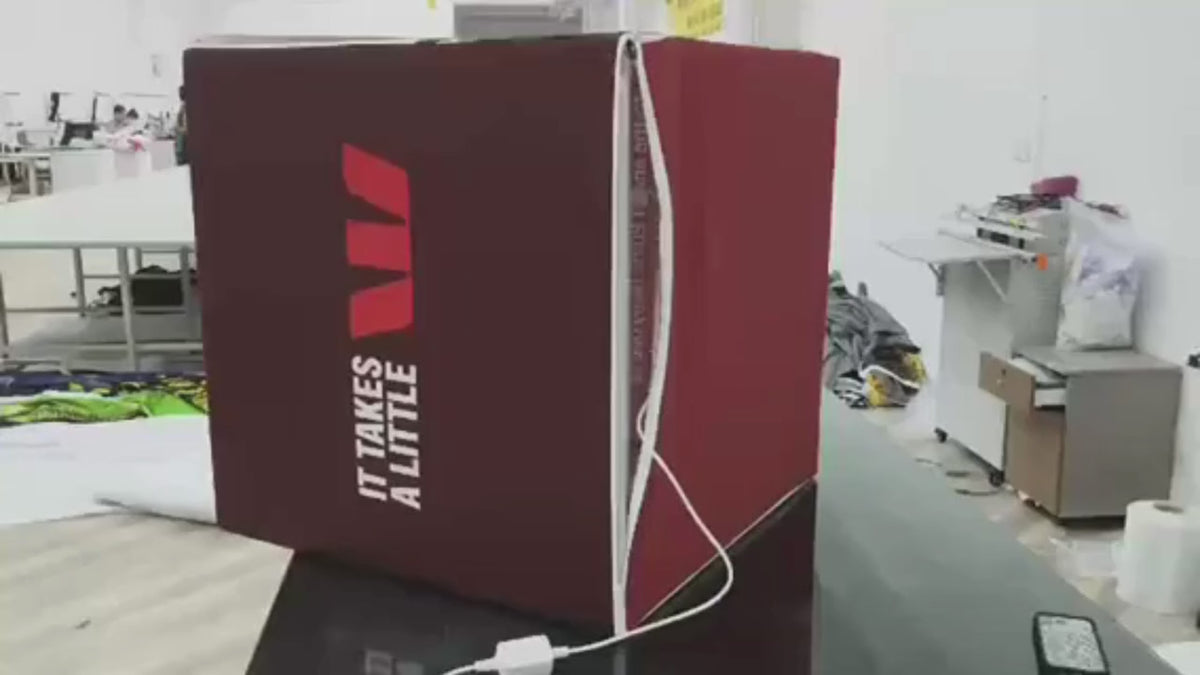 Load video: A fitted fabric skin zipped onto a backlit cube, then the finished cubes lighting up at Westpac's launch conference in Melbourne.